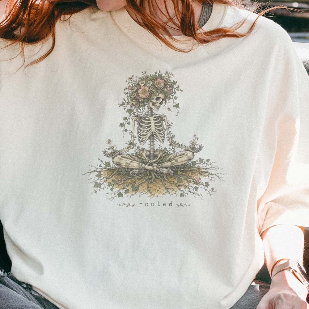 Rooted Skeleton Seated in Wildflower Crown Graphic Tee